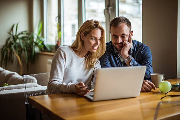 couple looking in the laptop